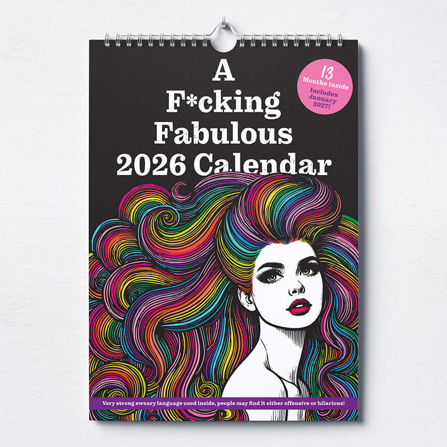 A 2026 wall calendar with bold text reading “A F*cking Fabulous 2026 Calendar” and colorful, stylized artwork of a woman with wavy, rainbow hair on a black background.
