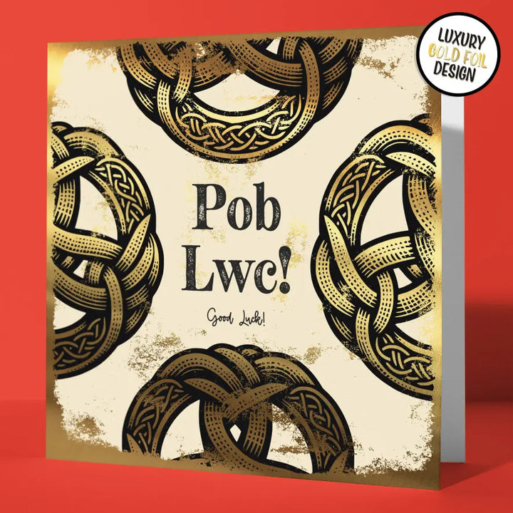 Greeting card with gold Celtic knot design and 'Pob Lwc!' text on a red background