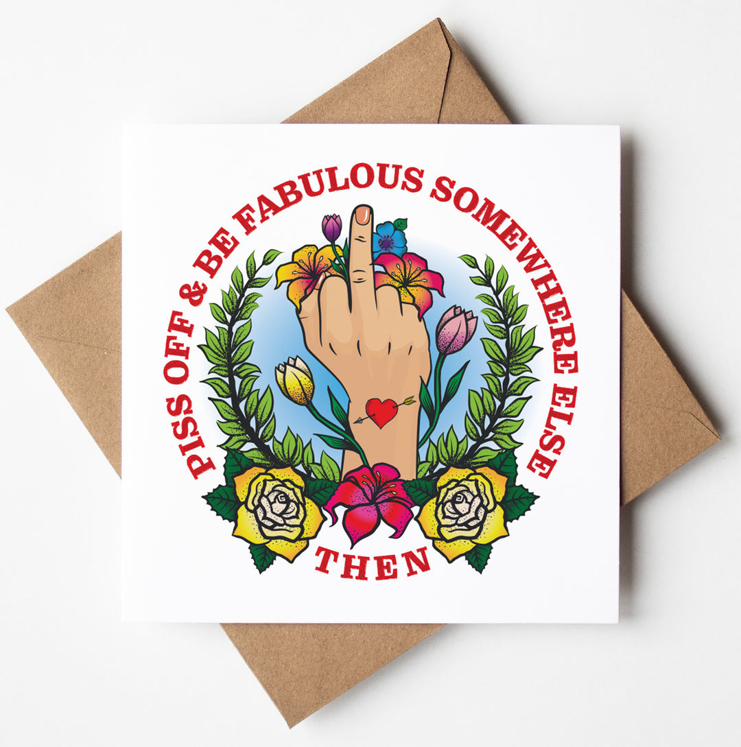 The "Piss Off Fabulous Tattoo Card" features a hand with the middle finger raised, adorned with floral illustrations. It includes the text: "Piss off & be fabulous somewhere else then." This card is packaged in a biodegradable bag and comes with a brown envelope. We offer worldwide shipping for this product.