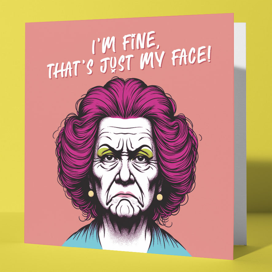 The “I'm Fine, That's Just My Face!” Funny Friendship, Vintage Style Rude Greetings Card features a stern older woman with purple hair and pearl earrings on a pink background—perfect for sharing laughs with friends.