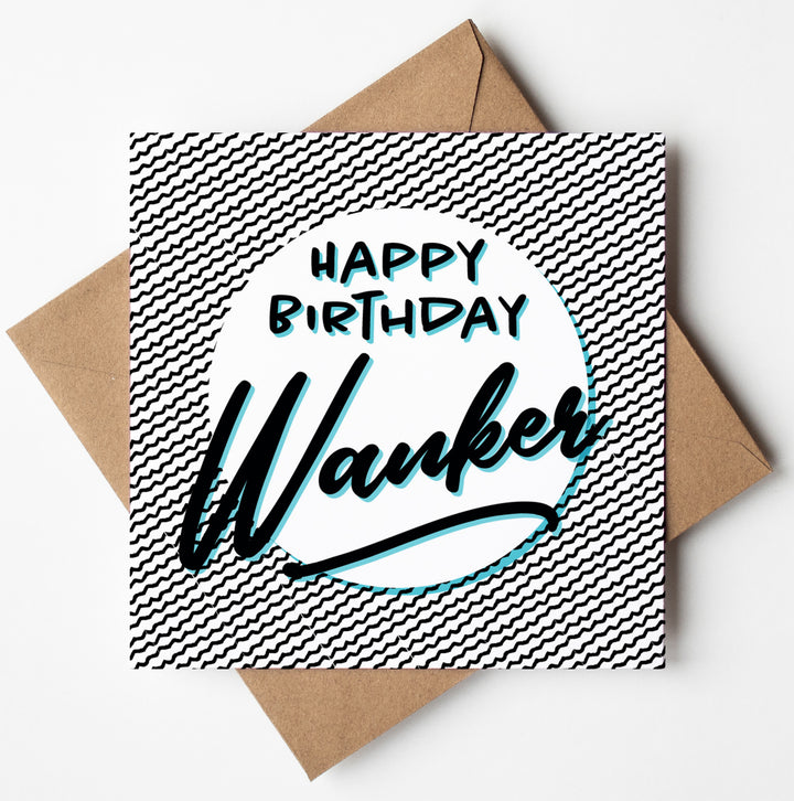 The "Happy Birthday Wanker Card" showcases a wavy black and white striped design with a white circle in the middle. It boldly displays the phrase "HAPPY BIRTHDAY Wanker" and comes paired with a brown envelope, all set against a white background. Ideal for those who enjoy an offensive touch of humor in their birthday greetings.