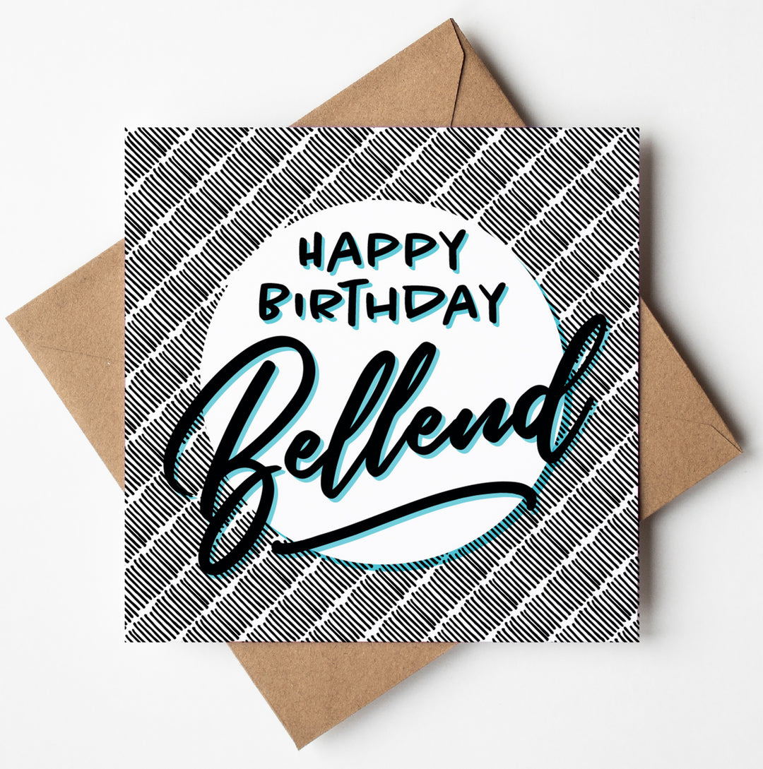 The Happy Birthday Bellend Card is a square birthday card featuring a patterned background and comes with a brown envelope. It is packaged in biodegradable materials and showcases the text "Happy Birthday Bellend" in bold, stylized letters.