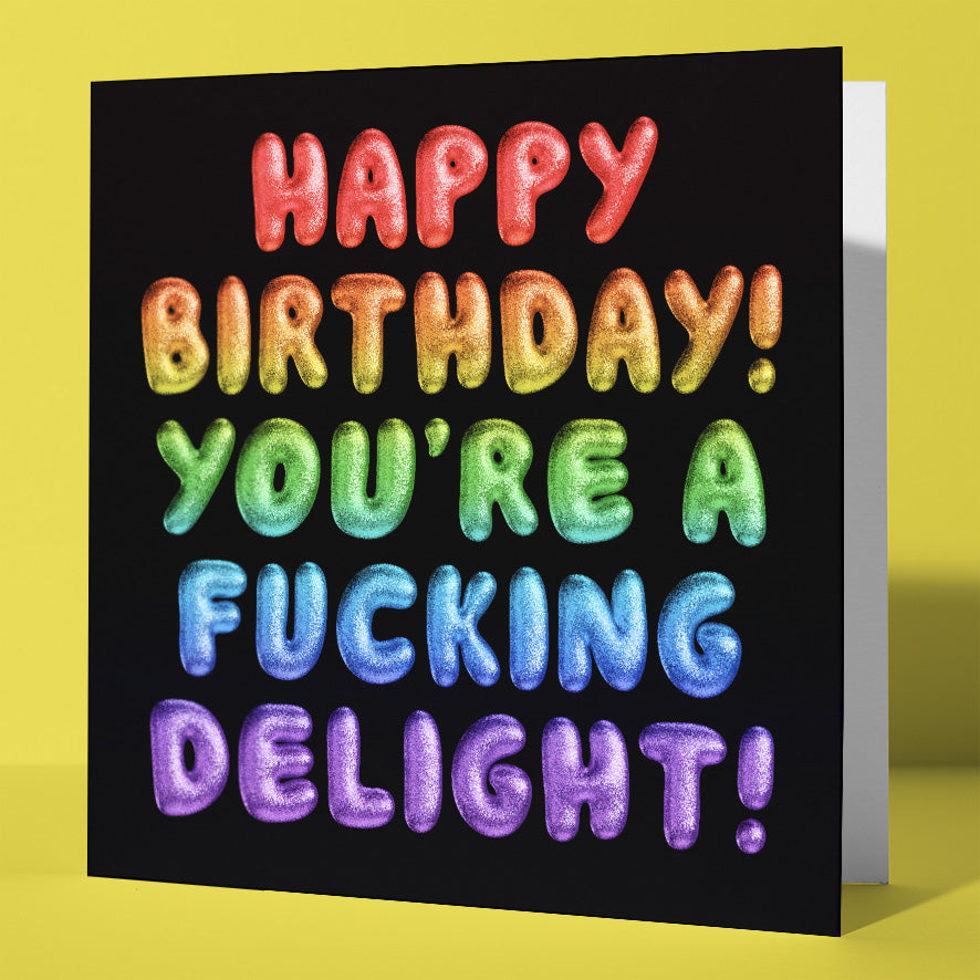The "Happy Birthday! You're a fucking delight! Rainbow Font Card" features bold, colorful bubble letters on black, each line in a different color. Sweary and fun, it's perfect for birthdays. Worldwide shipping available.