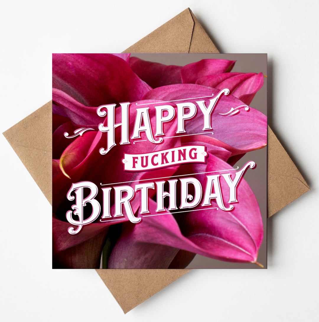 The "Happy Fucking Birthday Calla Lilies Card" features a square design with bold text against a backdrop of vibrant pink blossoms, and it comes with a plain brown envelope.