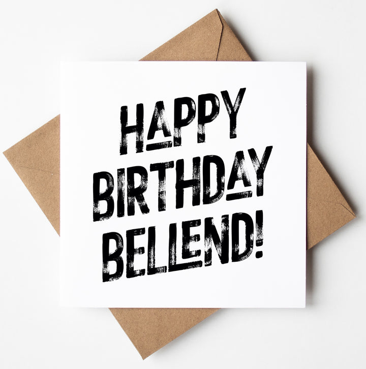 The "Happy Birthday Bellend! Harlem Card" features a white design with bold, black text that reads "HAPPY BIRTHDAY BELLEND!" It is displayed on a brown envelope against a white background and offers the convenience of worldwide shipping for easy delivery.
