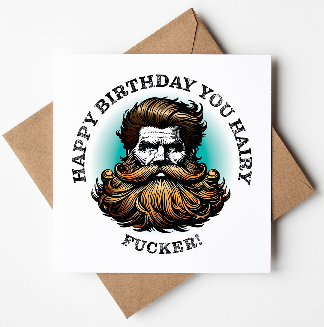 The "Happy Birthday You Hairy Fucker! Blonde Card" is a humorous birthday card featuring an illustration of a bearded man with styled hair. The text on the card reads, "Happy Birthday You Hairy Fucker!" and it comes ready to gift in a brown envelope, making it ideal for anyone who appreciates a sweary card.