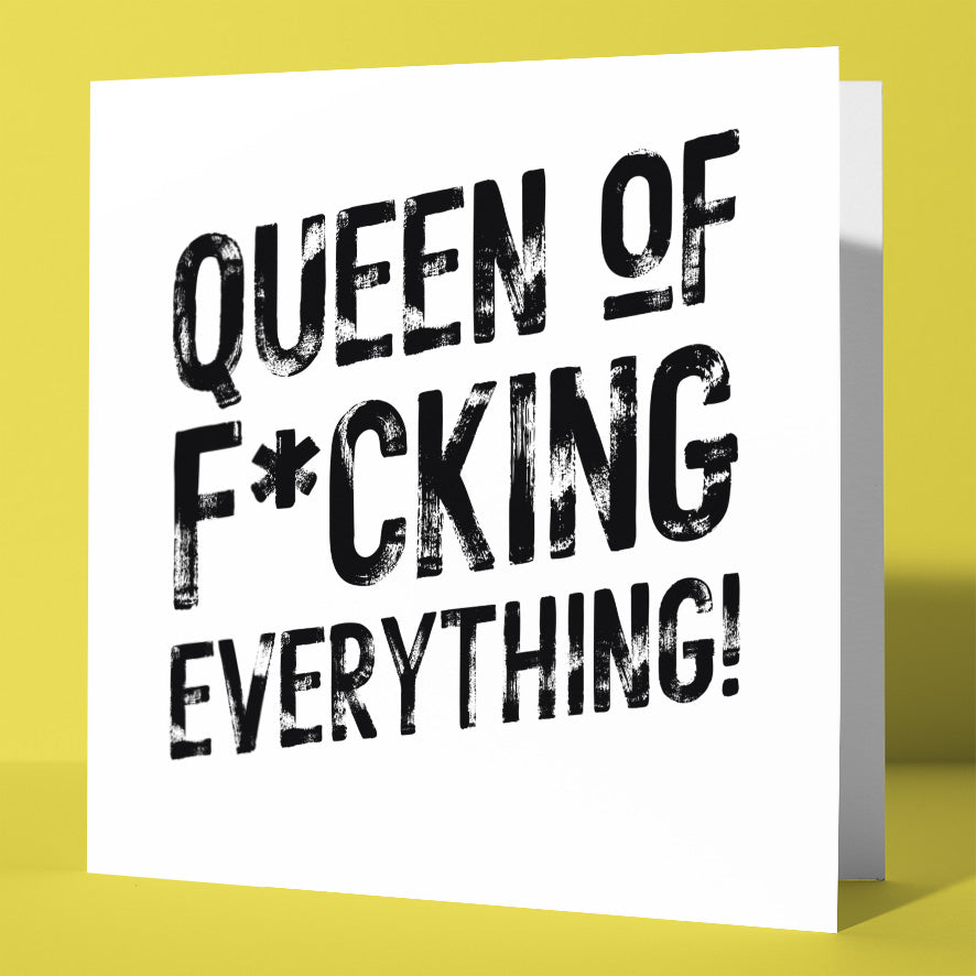 The Queen of F*cking Everything! Harlem Card features bold black text on white—ideal for birthdays or special celebrations. Shown on a yellow surface with a matching background.