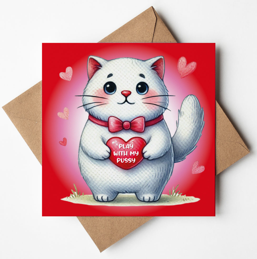 The "Play With My Pussy Cute Kitten Card" features a cartoon white cat with a red bow tie, holding a heart-shaped sign with its cheeky message. Against a red background with small hearts, this funny anniversary card comes beautifully placed in a brown envelope.