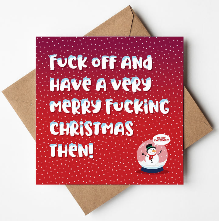 Fuck Off Merry Christmas Card with a red polka dot background and bold white text saying, 'Fuck off and have a very merry fucking Christmas then!' This amusing sweary card features a snow globe graphic with a snowman in the corner, perfect for an adult-themed holiday greeting. Comes complete with an envelope.