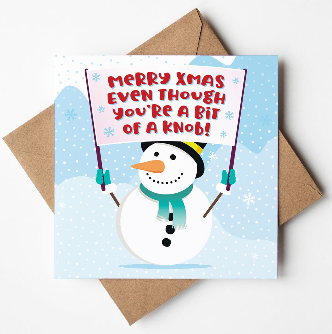 Funny Christmas card featuring a cheeky snowman holding a sign that reads, "Merry Xmas Even Though You're a Bit of a Knob!" against a snowy backdrop, perfect greetings card featuring some naughty Xmas humour.