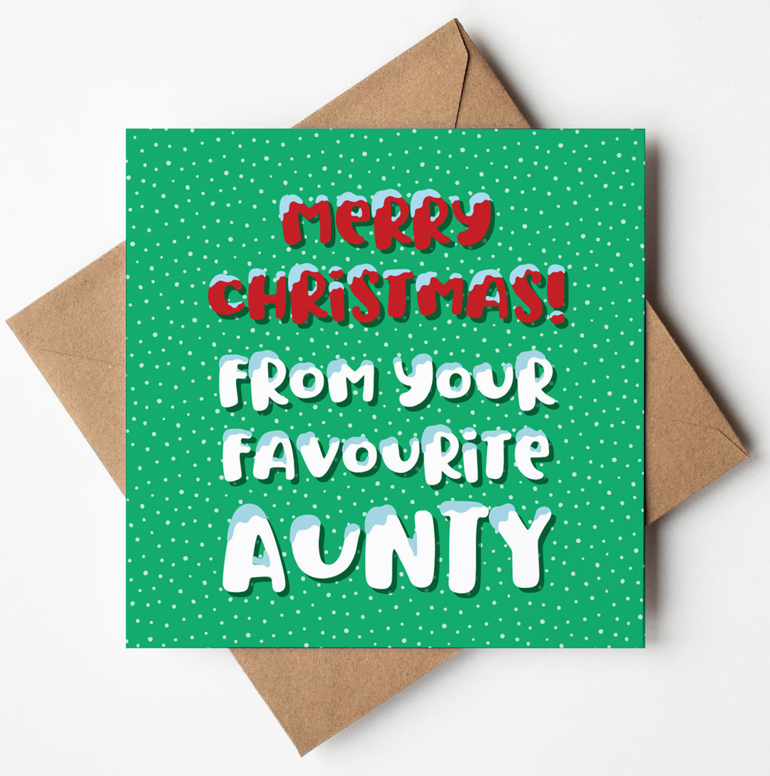 The "Merry Christmas from Your Favourite Aunty" Christmas Card is presented in a brown envelope. It features a green background with white polka dots and festive text that reads, "Merry Christmas! From your favourite aunty," in vibrant red and white letters, offering you the opportunity to personalize the message inside the blank card.