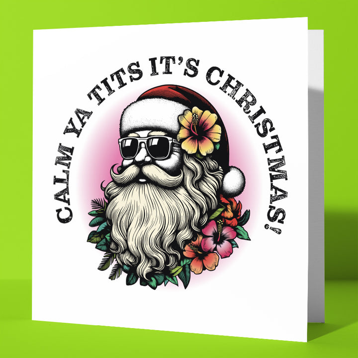 The "Sunglass Santa's Calm Ya Tits It's Christmas! Card" is a hilarious xmas card showing Santa in shades, a red hat, and flowers. The text reads: "CALM YA TITS IT'S CHRISTMAS!"—perfect for anyone with a cheeky sense of humor.
