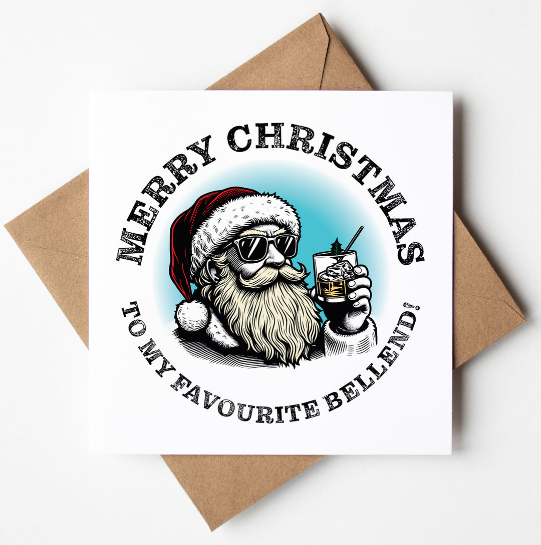 The "Sunglass Santa's Merry Xmas To My Favourite Bellend Card" features a bearded man sporting sunglasses and a Santa hat while holding a drink. It comes with a plain brown envelope, offering a cheeky touch of naughty holiday humor with the message: "Merry Christmas to my favourite bellend!