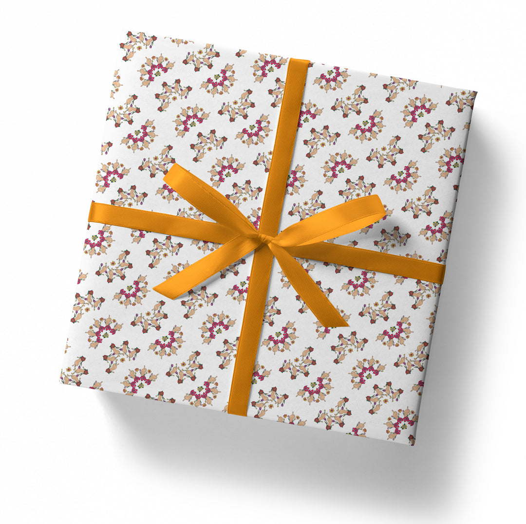A square gift box wrapped in SALE! Middle Finger Floral Gift Wrap (Folded Sheet) with a bold orange ribbon bow, set against a white background.
