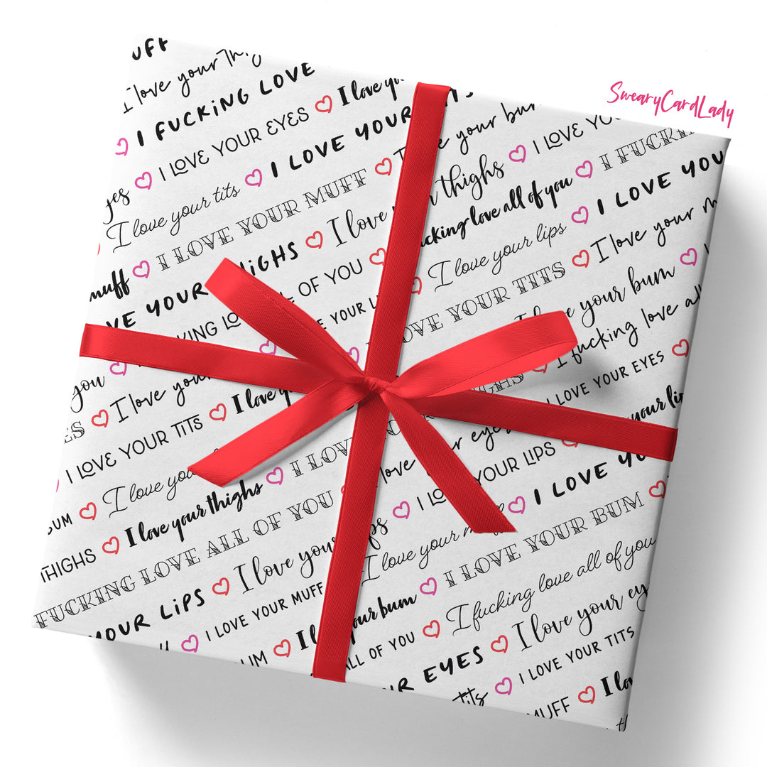Gift wrap featuring cheeky black and red phrases like “I love your lips,” “I love your bum,” and more. Finished with a red ribbon bow, this "I Love Your Tits" folded sheet is a funny Valentine or wife anniversary gift.