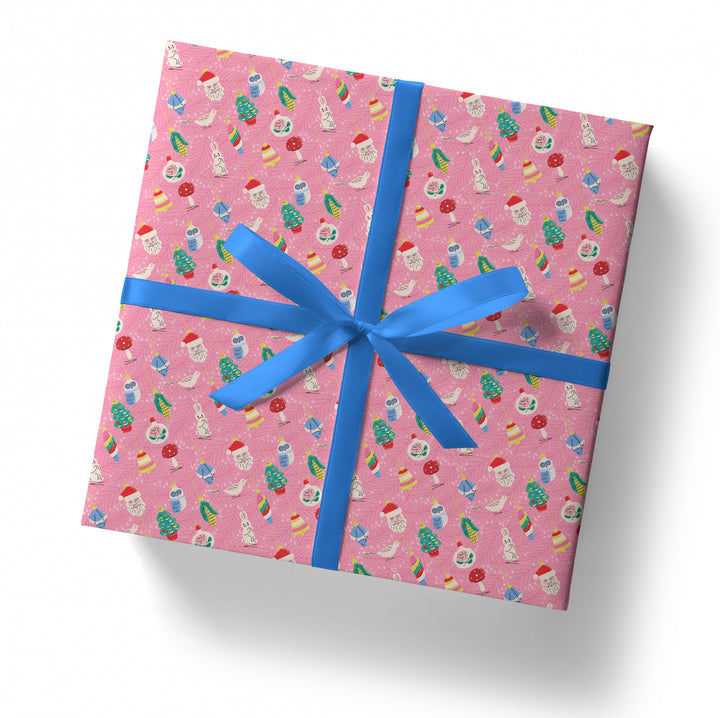Gift box with pink patterned paper and blue ribbon on a white background