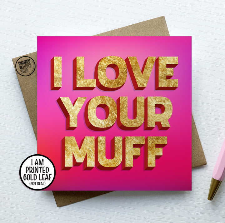 The "I Love Your Muff Card" humorously features pink with gold text and rests on a brown envelope. A circular label indicates, "I AM PRINTED GOLD LEAF (NOT REAL)." Ideal for a cheeky greetings card, this Valentine's Day gem is perfect for adding your personal touch with a pen.