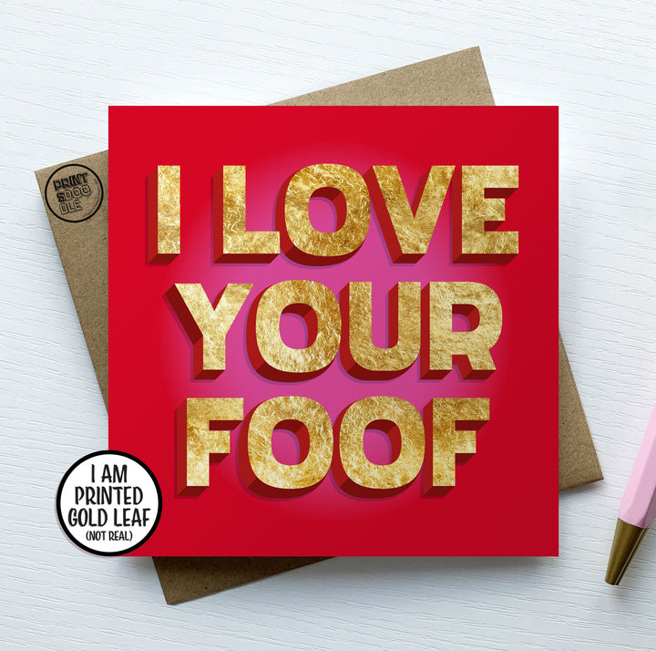 The "I Love Your Foof Card" is a square red Valentine card featuring bold text in a gold, glittery style that reads "I LOVE YOUR FOOF." It is set on a brown envelope against a white background. Nearby, a pencil and badge announce "I AM PRINTED GOLD LEAF (NOT REAL).