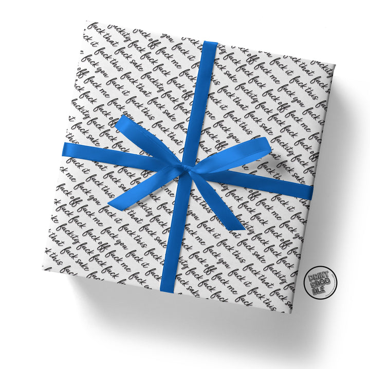 A square gift box wrapped in Fuckity Fuck Gift Wrap, showcasing the word "fake" printed repeatedly in black. It is adorned with a shiny blue ribbon and features a small round tag that reads "Luxury Doodle Box" attached to the bottom corner.