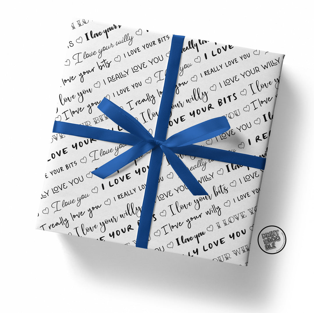 The "I Love Your Willy Gift Wrap (Folded Sheet)" is a square gift wrapped in white paper, featuring humorous text such as "I love you willy," "I love your bits," and "I really love you." It's adorned with a blue ribbon and includes a black and white circle sticker on the side, making it perfect for a playful Valentine’s Day gift.