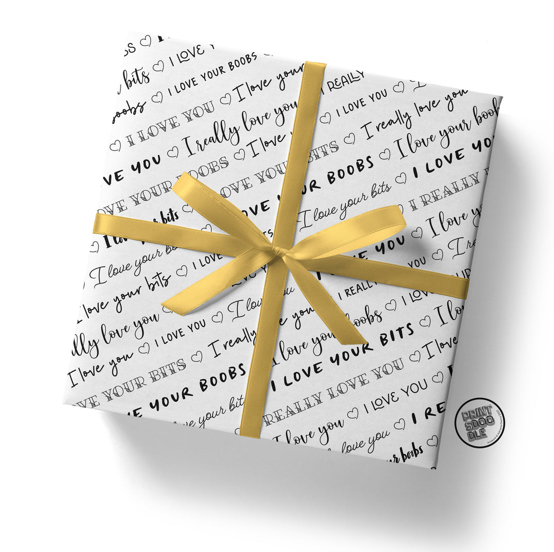 A gift box wrapped in sexy wrapping paper adorned with black text declaring "I love you" and "I love your boobs," all tied together with a playful yellow ribbon. Perfect as an anniversary gift or Valentine gift, this package is sure to delight and surprise.